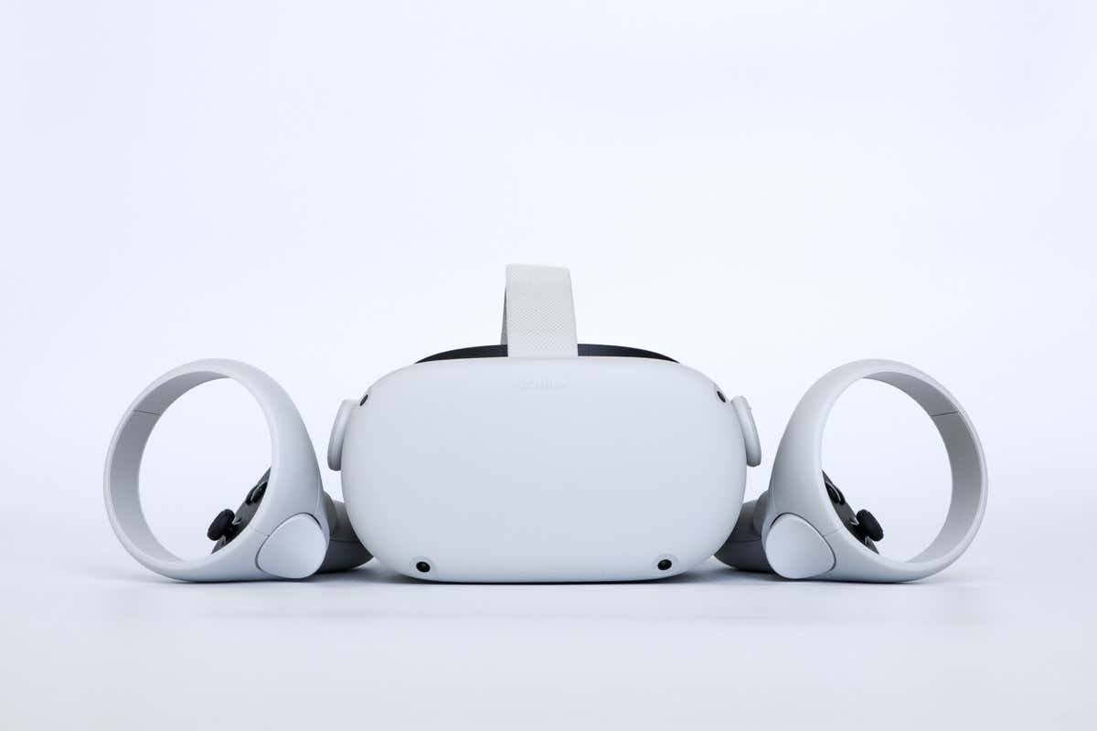 Bangkok, Thailand - April 14 2022 : Oculus Quest 2 virtual reality headset with controllers developed by Reality Labs, a subsidiary of Meta Platforms. - Online Tech Tips 6 Best Meta Quest 2 Productivity Apps image - Bangkok, Thailand - April 14 2022 : Oculus Quest 2 virtual reality headset with controllers developed by Reality Labs, a subsidiary of Meta Platforms.
